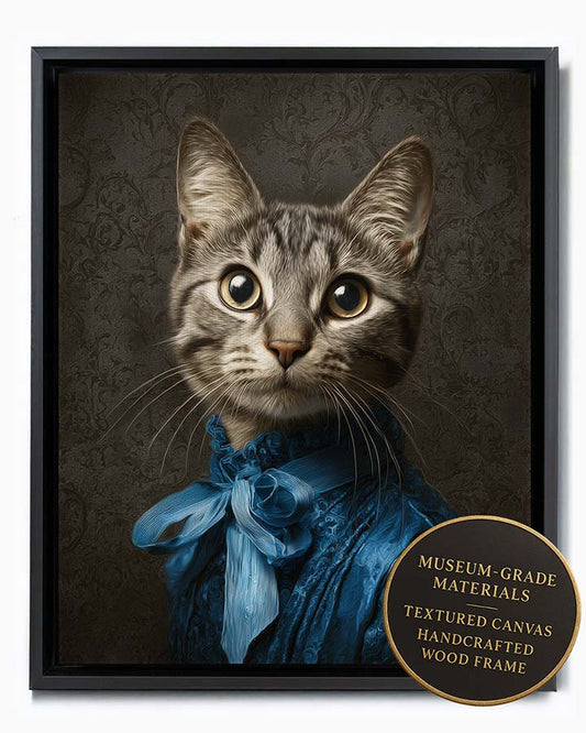Wagwag Art Baroque-inspired custom pet portrait – a cute female tabby cat in royal blue silk gown with large bow and ruffled collar, dark damask background, shown in black frame